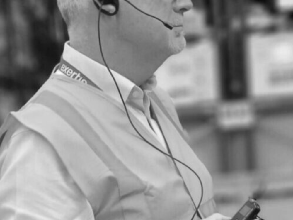 person wearing tourguide earpiece